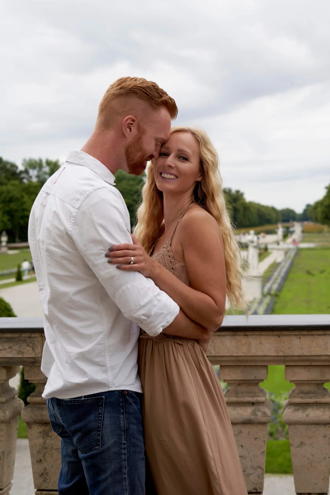 Couple photos by the canal in front of Nymphenburg Palace with reflection in the water
