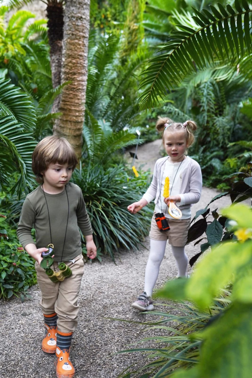Little explorer with a compass and binoculars during a children's photoshoot in Munich